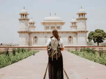 Traveler visiting a white palace